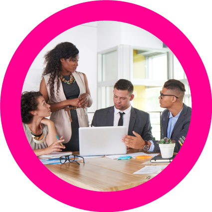 group photo employees at desk with laptop